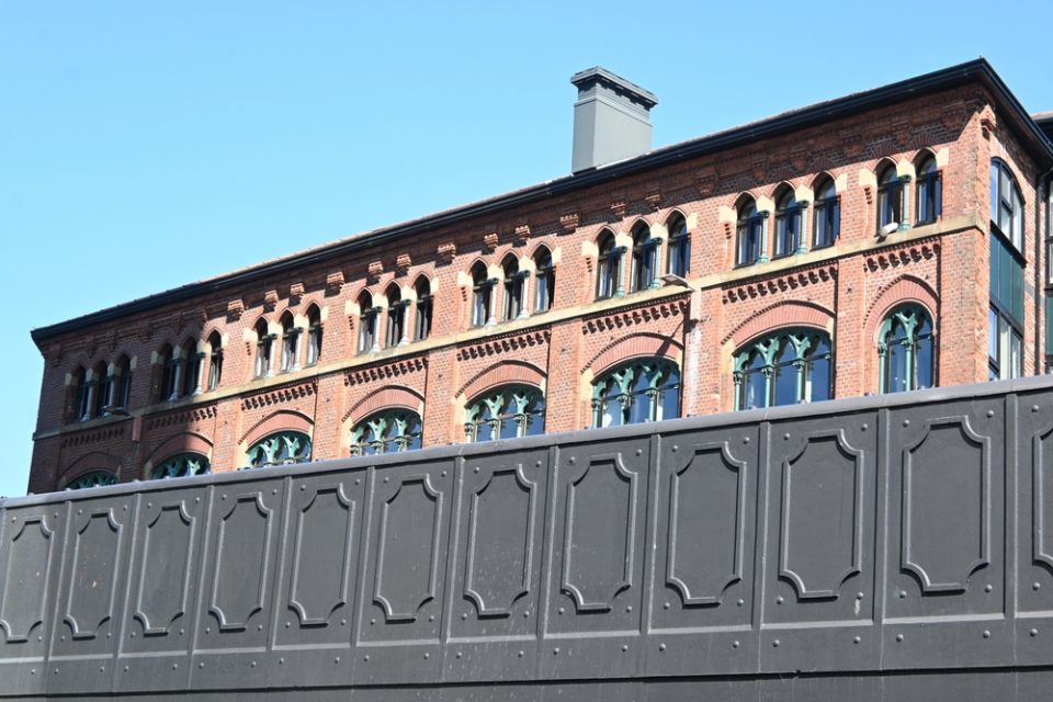 Victorian brick building with arcaded upper storey in Rochdale, UK, reflecting traditional architecture and local property market trends for buyers considering investment in 2026–2027.